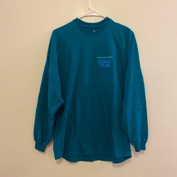 Disney Cirque du Soleil Glittery Teal Long Sleeve Spirit Jersey - Picture 2 of 5